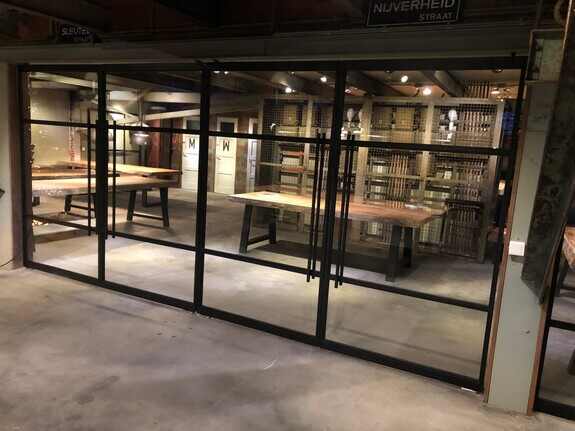 Customised black steel doors with slim profiles and large glass panels