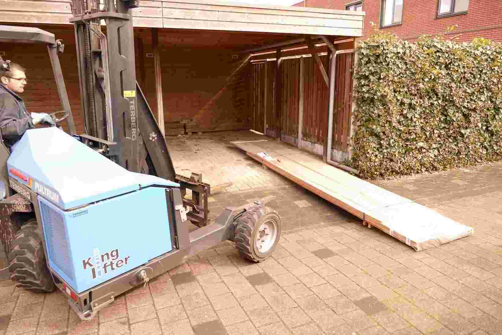 A mobile forklift unloads hardwood timber packages directly at the customer home