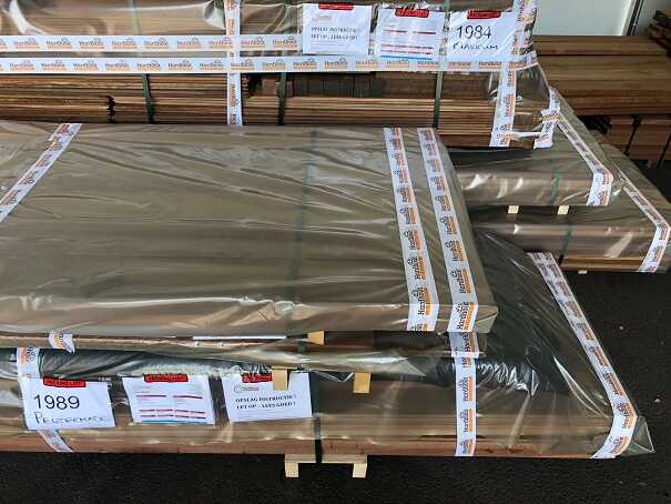 A securely strapped and protected package of timber ready for safe transport