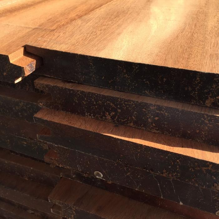 A neatly stacked pile of premium Ipe hardwood planks ready for outdoor construction projects
