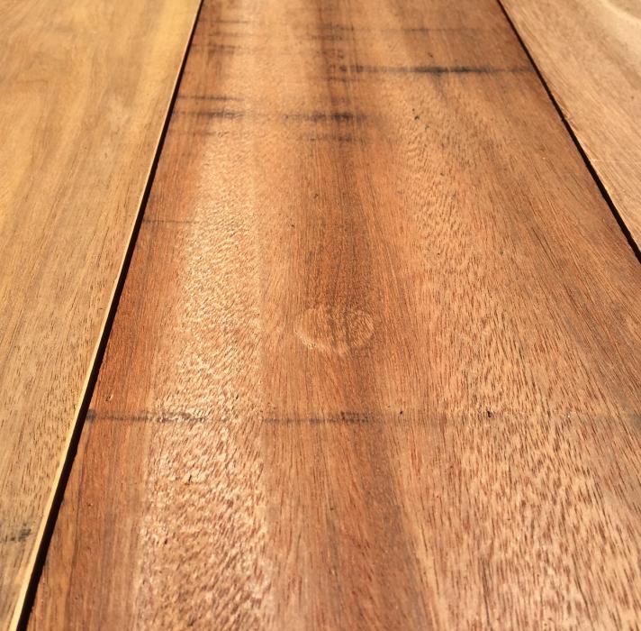 Close up view of durable Ipe hardwood planks showing the smooth finish and natural wood grain