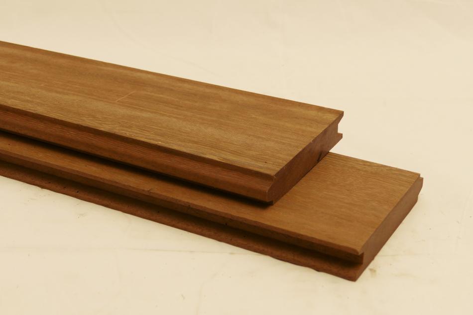 A high quality smooth planed Ipe hardwood plank with tongue and groove profile