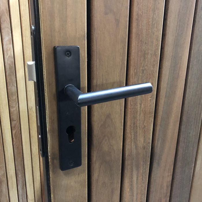 Hardwood modern gate with black door hardware