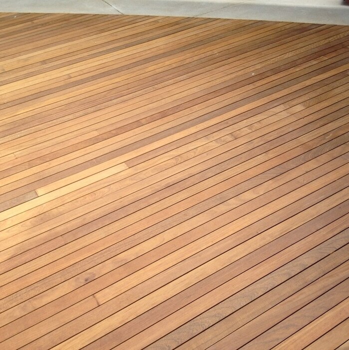 Garden terrace fitted with narrow Ipe hardwood decking boards using concealed fasteners