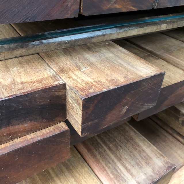 Stack of premium smooth planed Ipe hardwood beams for construction