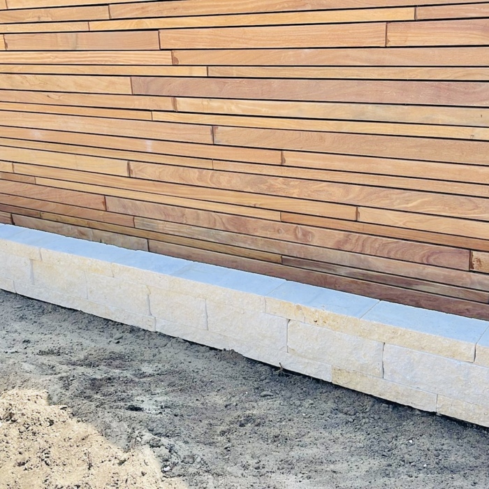 Ipé slatted fence with black EPDM privacy screen for 100% privacy and contrast.