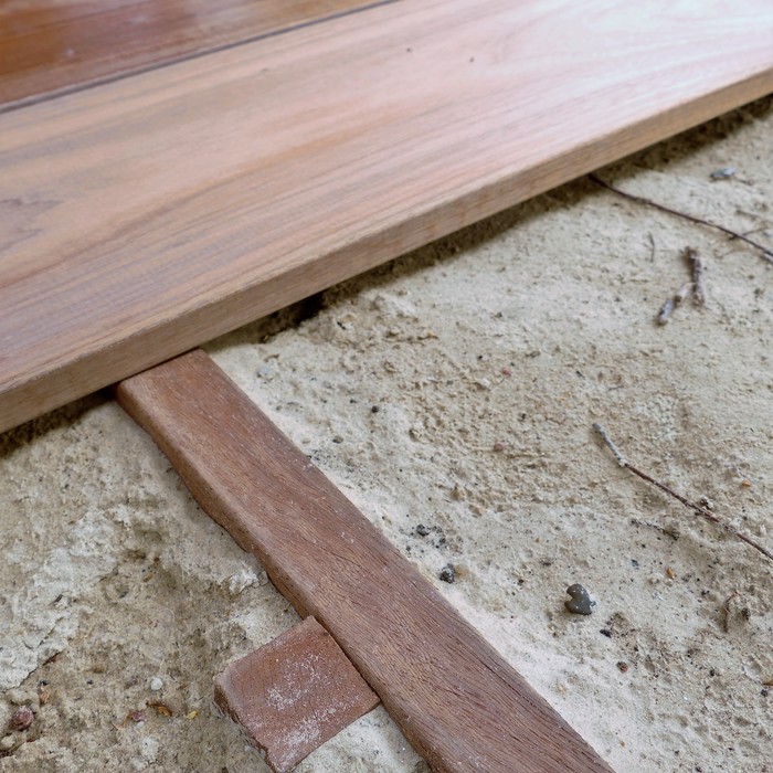 Smooth planed Ipe hardwood underlying beam designed for strong decking foundations
