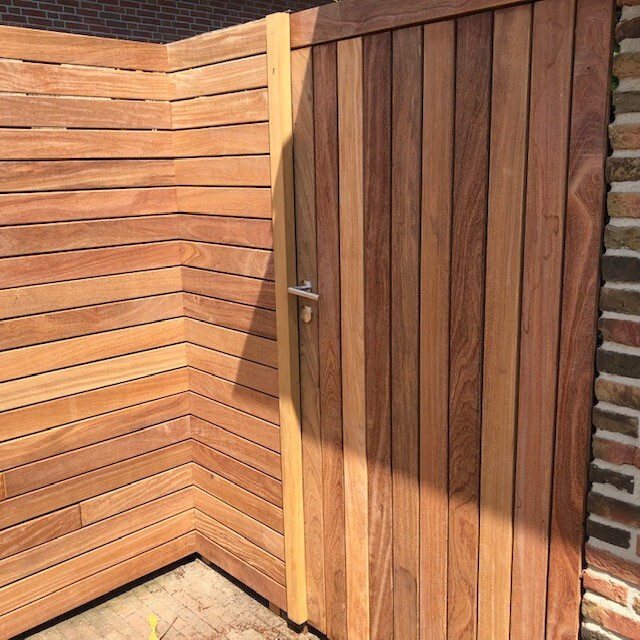 Modern gate and fence of IPE timber