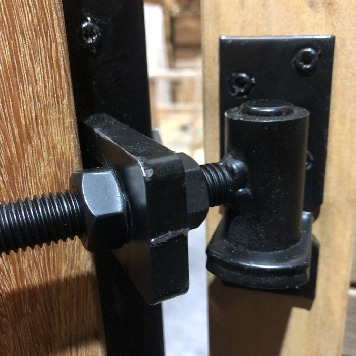 Modern gate fittings with black staves and hinges