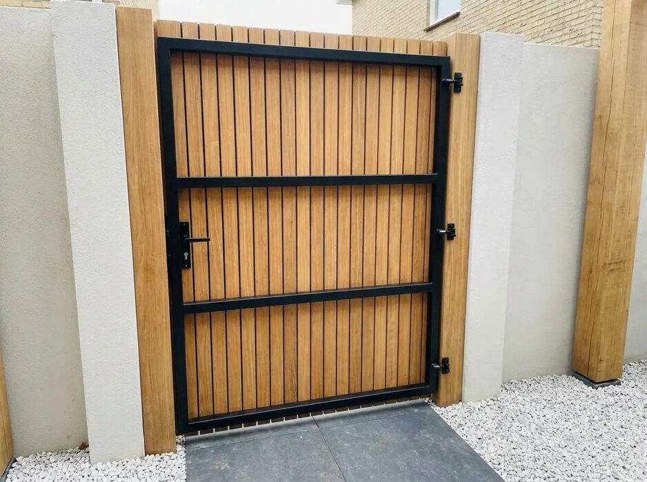 Teak bespoke gate clad on one side with 50 mm slats, back view