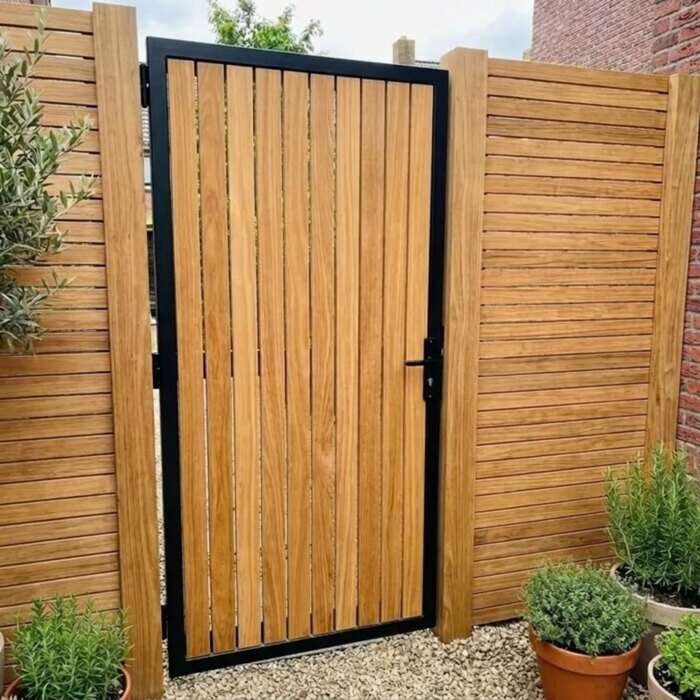 Teak garden gate with a 1.9 m steel frame in a 2 metre fence Teak garden gate with a 1.9 m steel frame in a 2 metre fence