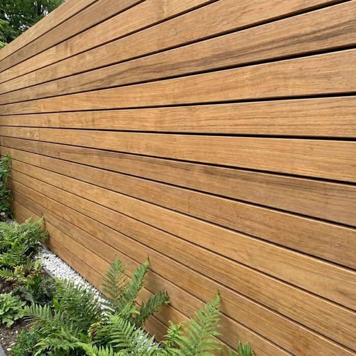 Close up of 50 mm teak slats laid with staggered joints and no visible screws Close up of 50 mm teak slats laid with staggered joints and no visible screws