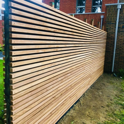 Modern Ipe fence made of hardwood in lamellar design