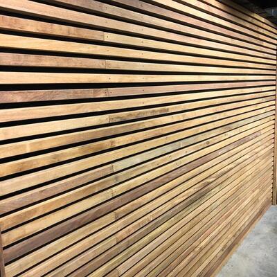 Modern wall of Ipe wood in 4x4 beams