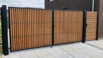 Ipe bespoke double gates with 40 x 40 mm battens for a driveway