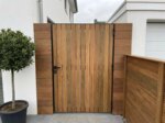 Ipe bespoke gate in a side passage, clad on both sides with 70 mm slats