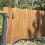 Modern fence of tripple boards IPE WOOD fully enclosed