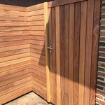 Modern gate and fence of IPE timber