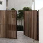 Modern slatted gate with bars of ipe wood
