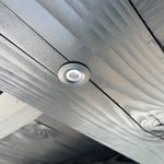 Recessed LED spotlight in roof beam of modern canopy / veranda 