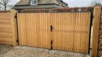 Teak bespoke double gates at a country house, 70 mm slats