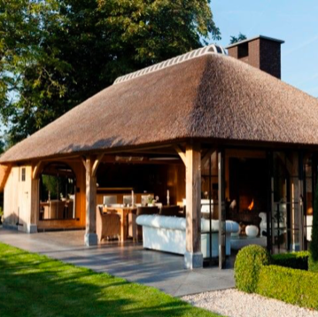 Luxury bespoke oak framed gazebo with a traditional thatched roof