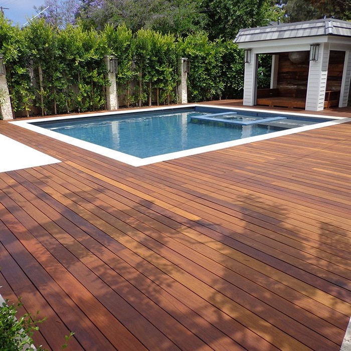 Luxury Ipé hardwood pool deck in Bonaire treated with dark UV-protective oil