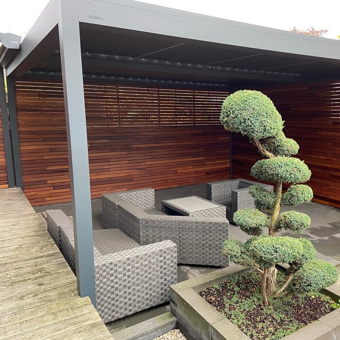 garden inspiration and Atmospheric timber slatted wall inside a garden shelter, providing a contemporary linear design and natural sun shading
