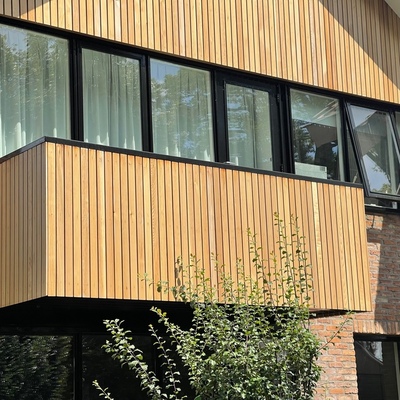 Vertical cladding made from Ipe hardwood slats on a modern house
